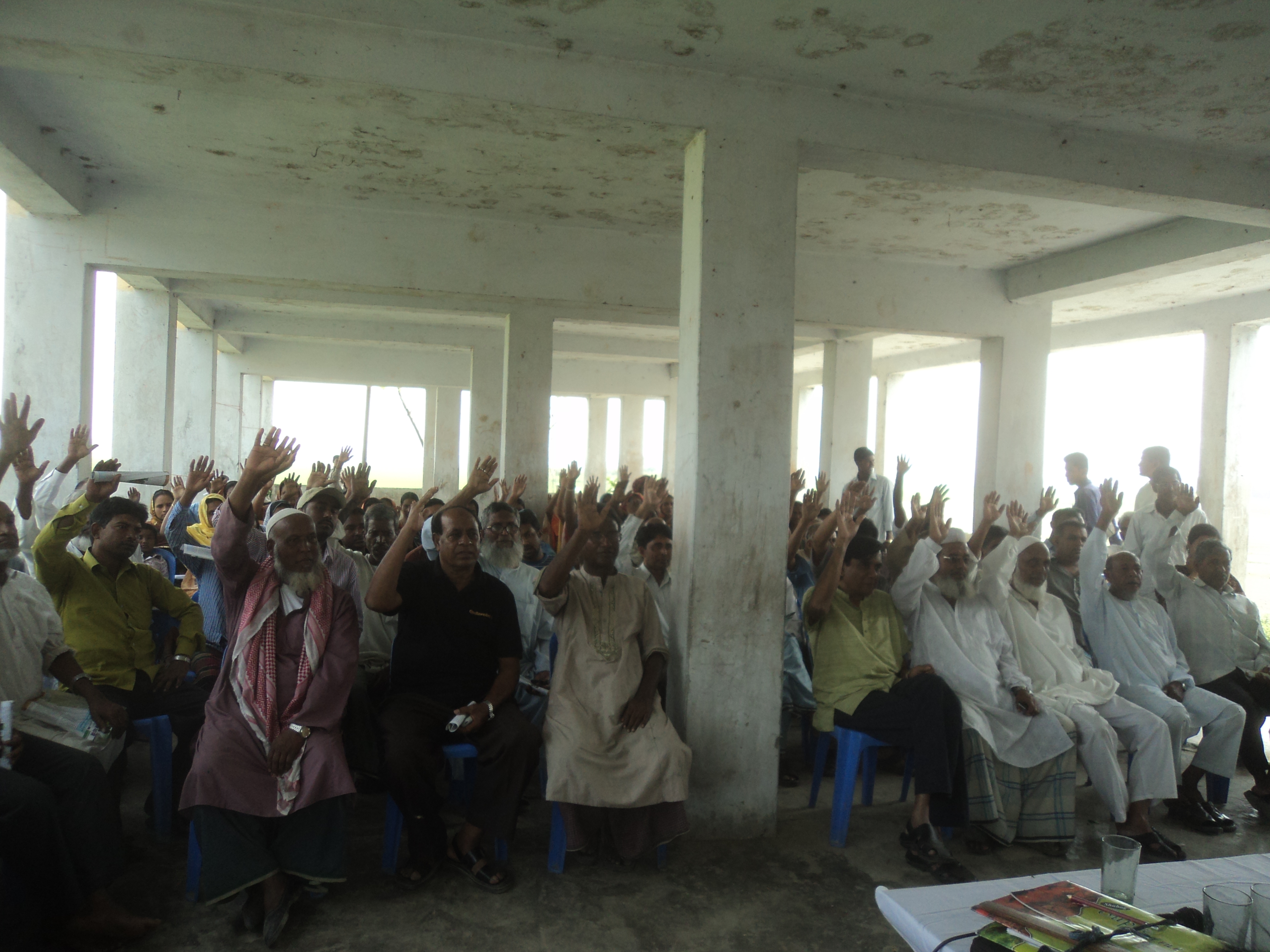 villagers of bio villages project attending a monthly meeting